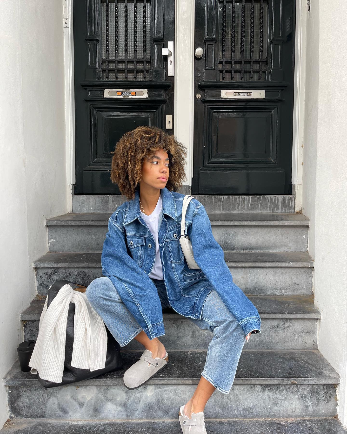 Influencer wears jeans and Birkenstock Bostons.